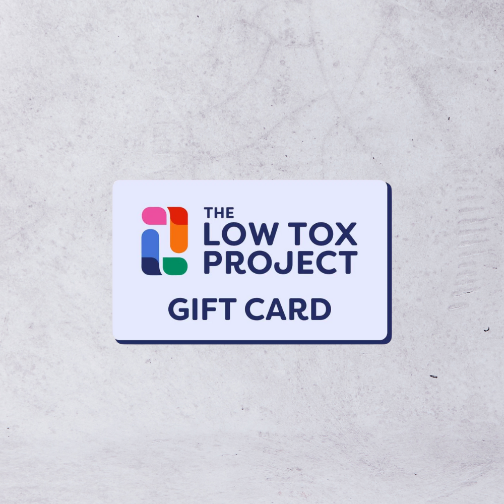 Gift card from The Low Tox Project on a textured gray background